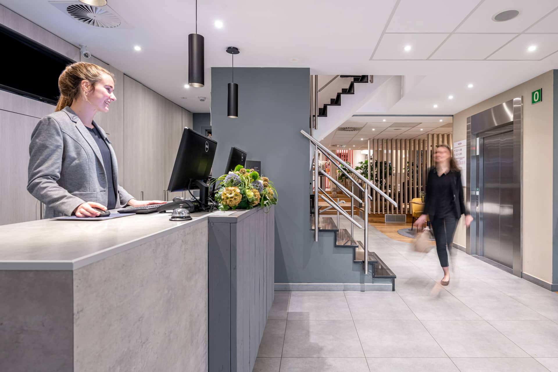 Mercure Oostende Guest Checking at Reception Desk